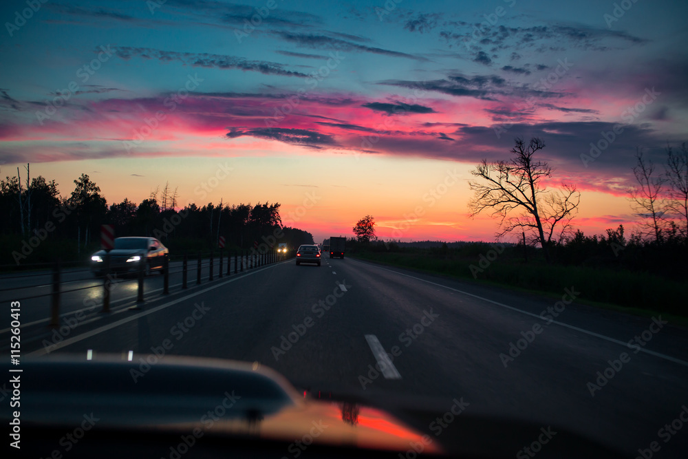 Obraz premium Drive car at beautiful sunset. Nature landscape