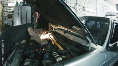 Car mechanic details of the car in the car service, wide angle, slider photo