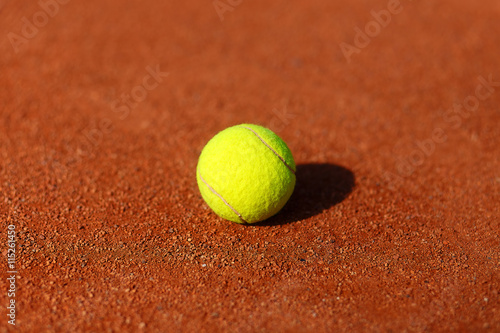 tennis court with tennis ball and antuka background. © jozefklopacka