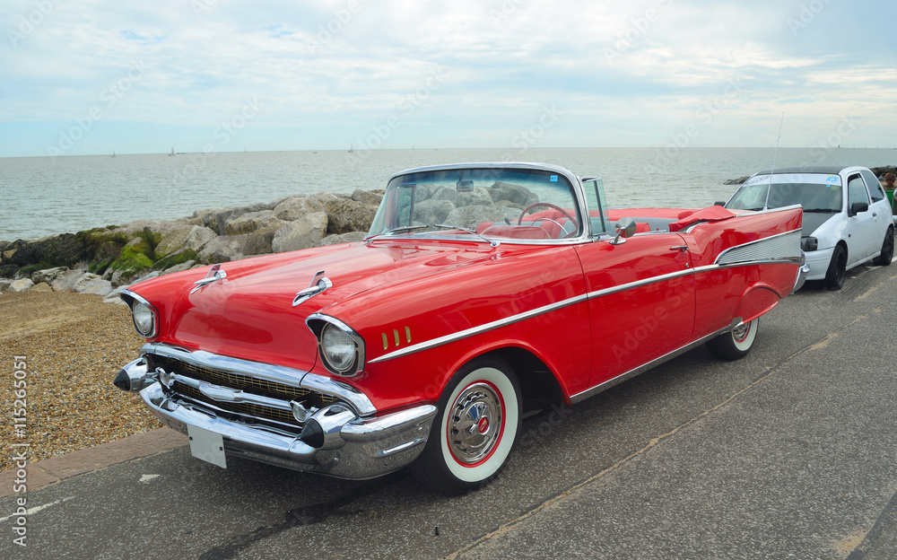 Classic Red convertible on show on Felixstowe seafront. - obrazy, fototapety, plakaty 