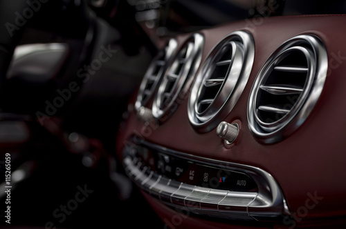 Modern car leather dashboard. Interior detail. © alexdemeshko