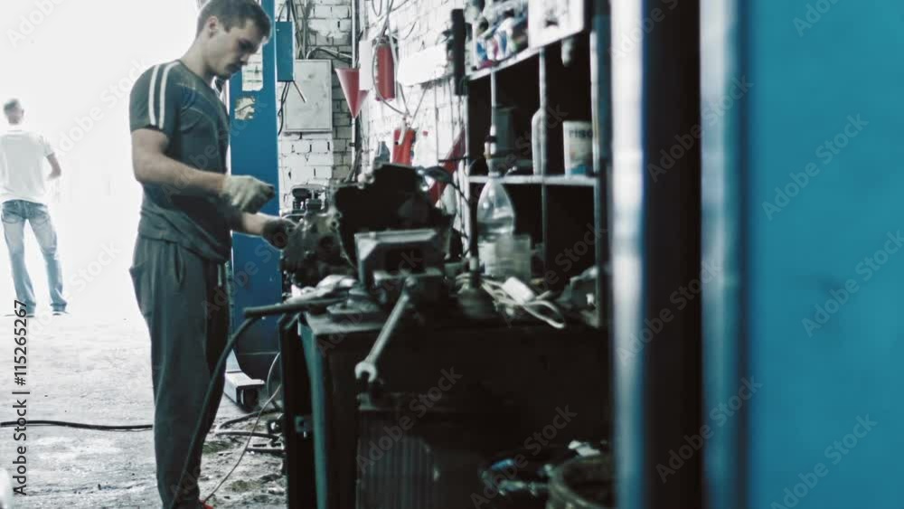 Mechanical repairs a part of the car in car service Mechanical repairs a part of the car in car service