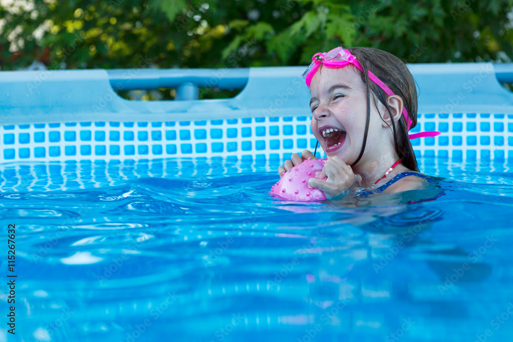 Excited happy little girl in swimming pool Stock Photo | Adobe Stock
