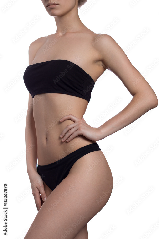 Fototapeta premium fitness woman in black lingerie isolated on white background hand on waits