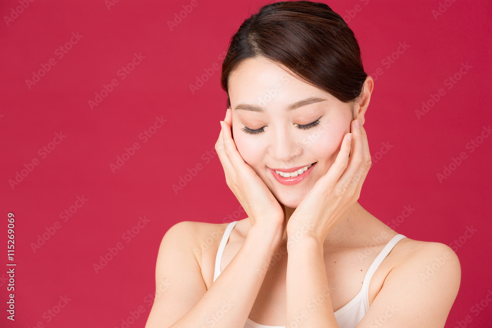 attractive asian woman isolated on red background attractive asian woman isolated on red background