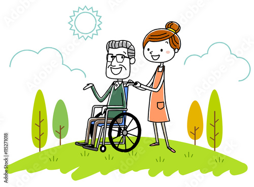 車椅子のシニア男性と女性介護スタッフ
