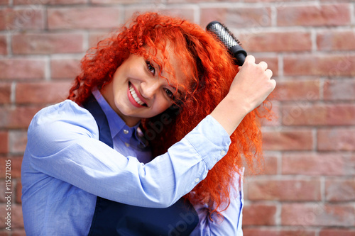 Red haired beautiful girl w...