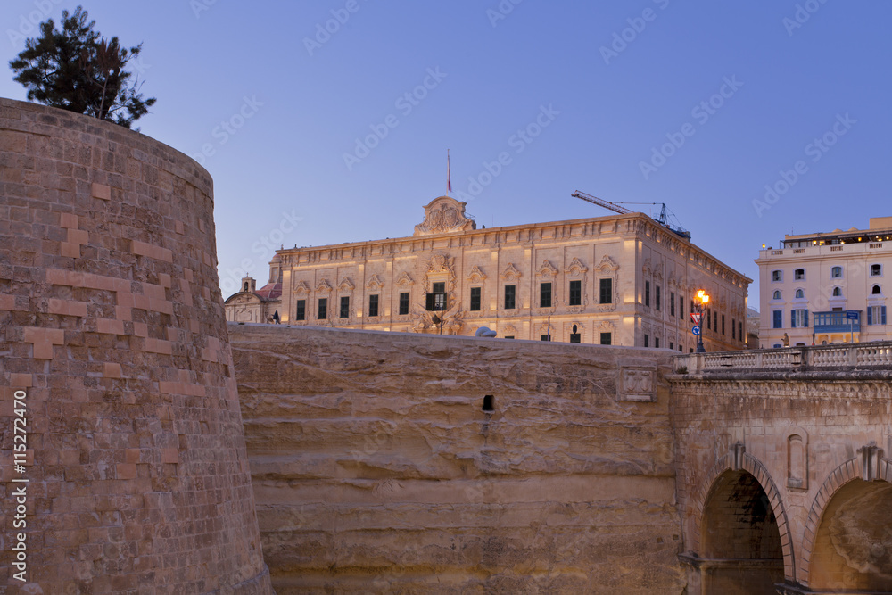 The medieval city walls of La Valletta, Malta at sunset 