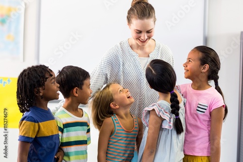 female teacher with schoolchildren