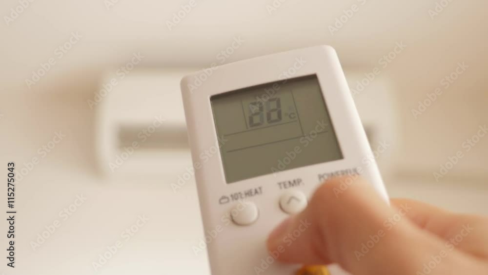 Cooling down room by changing temperature on air conditioner 4K 2160p UHD video - Changing room temperature with AC remote controller 4K 3840X2160 UHD footage Cooling down room by changing temperature on air conditioner 4K 2160p UHD video - Changing room temperature with AC remote controller 4K 3840X2160 UHD footage