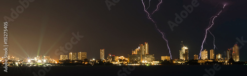 Panorama cityscape of Pattaya city in Thailand, at night with thunderbolt