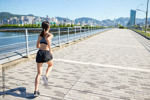 Woman running in Hong Kong city