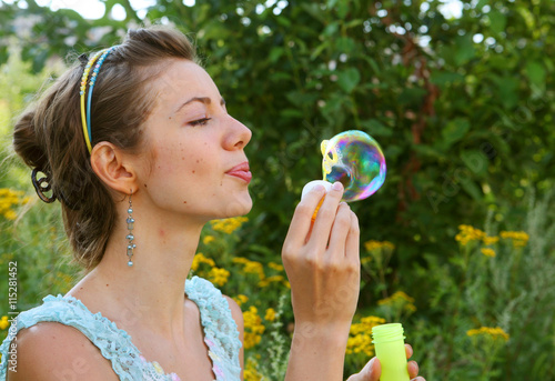 woman  starts soap bubbles 