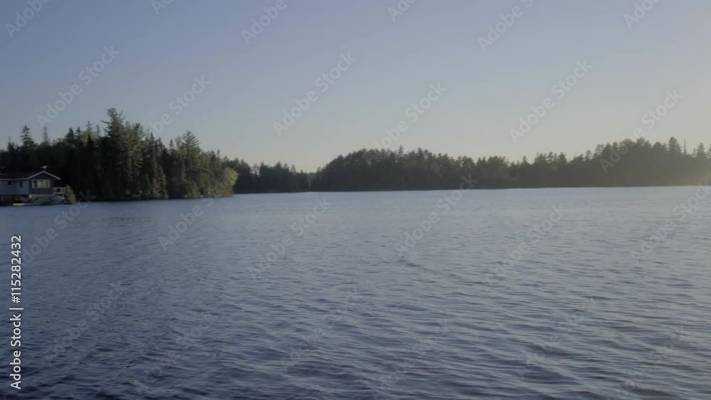 fishing boat on a small canadian lake in ontario relaxing summer vacations fishing boat on a small canadian lake in ontario relaxing summer vacations