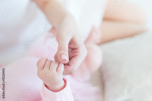 hand in the hand. motherhood