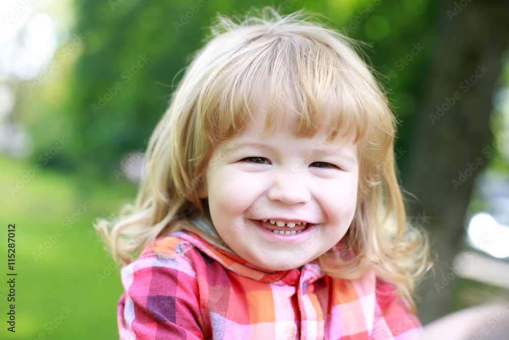 happy small boy on green natural background happy small boy on green natural background