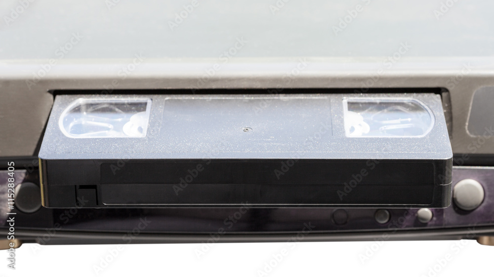 videocassette in video recorder isolated videocassette in video recorder isolated