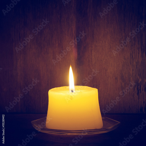candles on old wooden background  vintage style