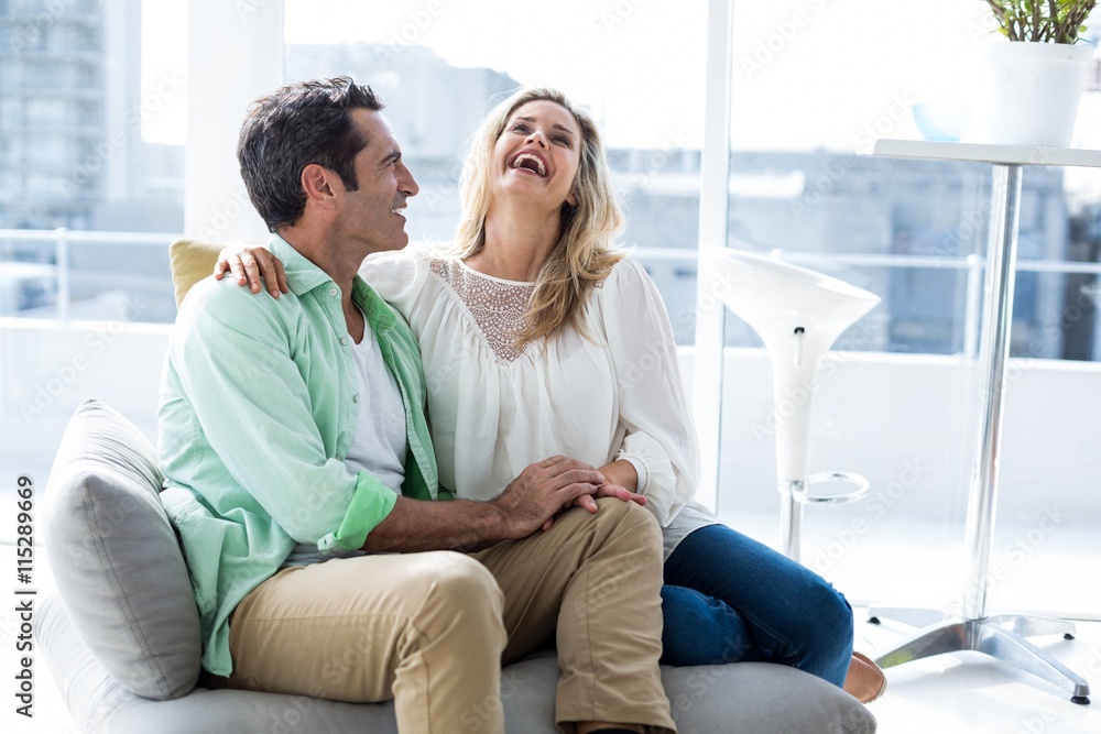 Couple relaxing on sofa at home Couple relaxing on sofa at home