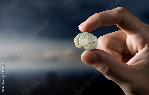 Small brain between fingers . Mixed media photo