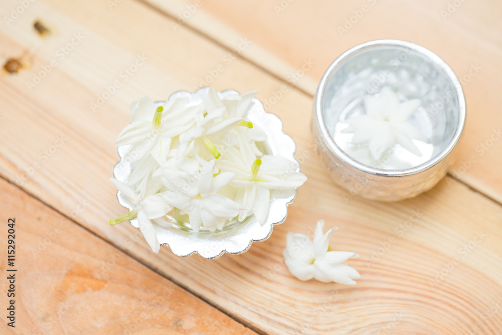 water in silver bowl with jasmine white flower, Thailand Songkarn water in silver bowl with jasmine white flower, Thailand Songkarn