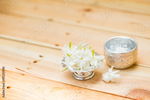 water in silver bowl with jasmine white flower, Thailand Songkarn