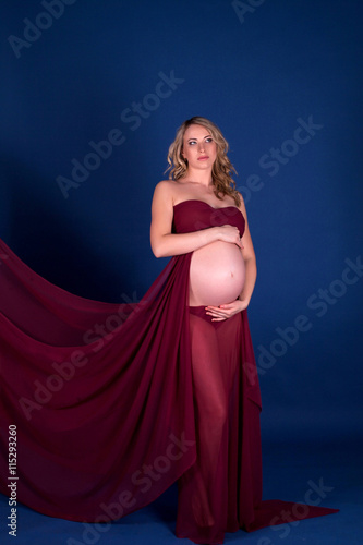 Pregnant woman in red dress