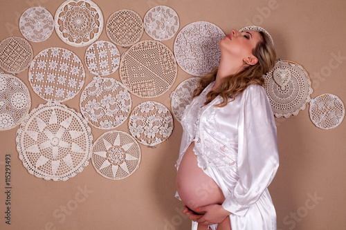 Pregnant woman in dressing-gown photo