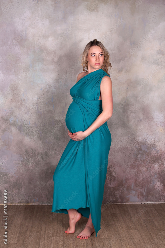 Pregnant woman in blue dress