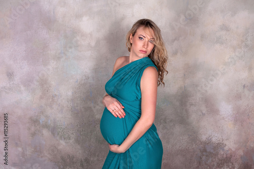 Pregnant woman in blue dress