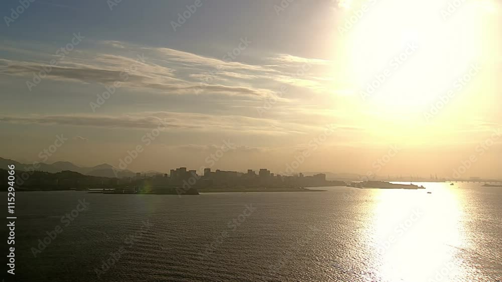 Low angle aerial view of Rio De Janeiro skyline with Sunset light reflection in the ocean, Brazil Low angle aerial view of Rio De Janeiro skyline with Sunset light reflection in the ocean, Brazil