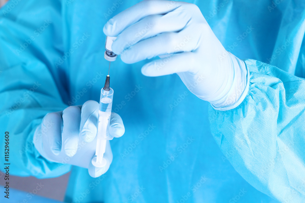 syringe in the hands of the doctor, close-up syringe in the hands of the doctor, close-up