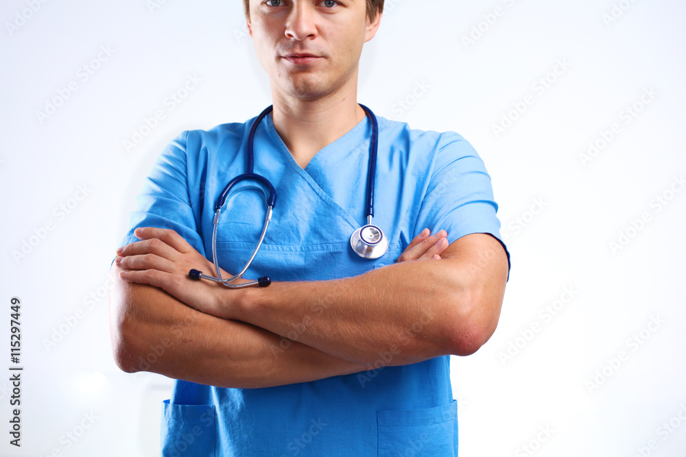 young surgeon standing with his arms crossed young surgeon standing with his arms crossed
