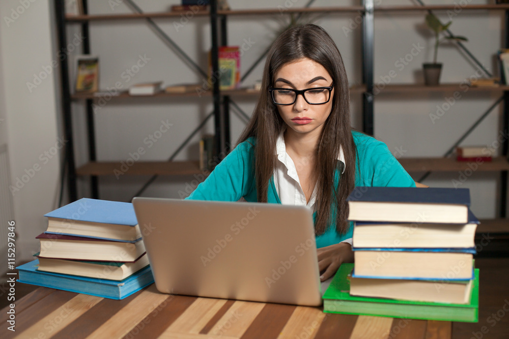Lots of books and laptop Lots of books and laptop