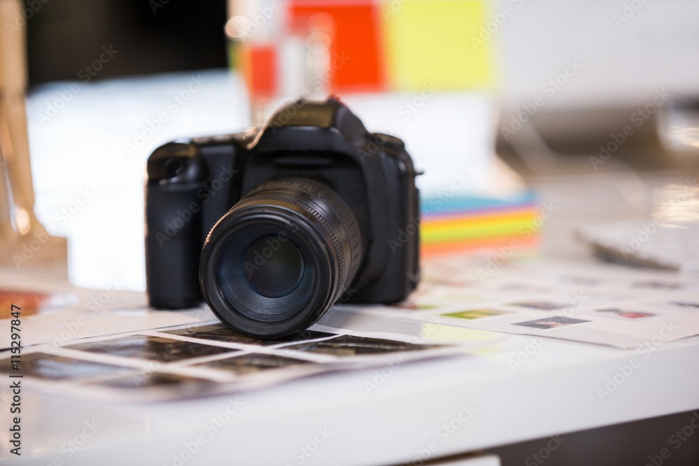 Camera on photographs at desk Camera on photographs at desk