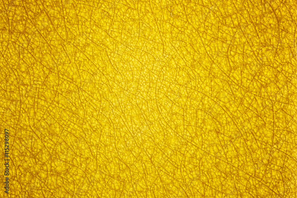 An abstract yellow gold background with a pattern of glass crack An abstract yellow gold background with a pattern of glass crack