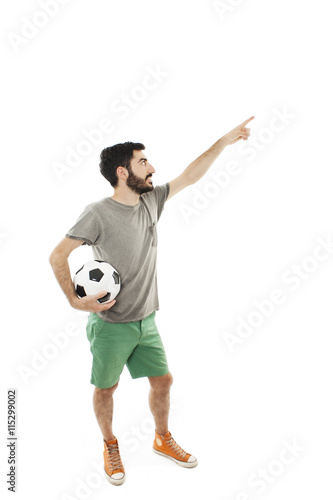 Young man holding ball and beer, pointing. Isolated on white background   © Jelena Ivanovic
