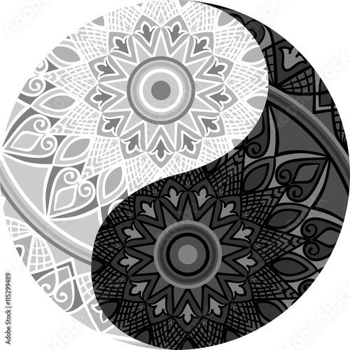 Drawing of a black and white mandala (round ethnic ornament) in shape of symbol yin yang