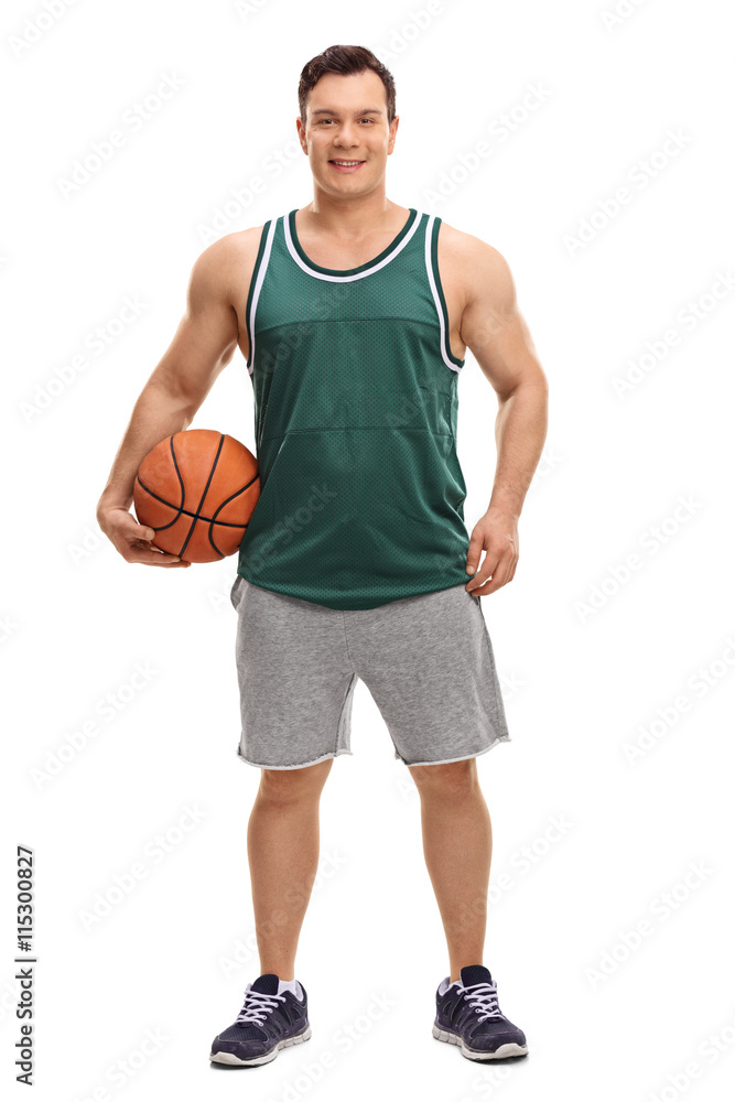 Fototapeta premium Young man holding a basketball