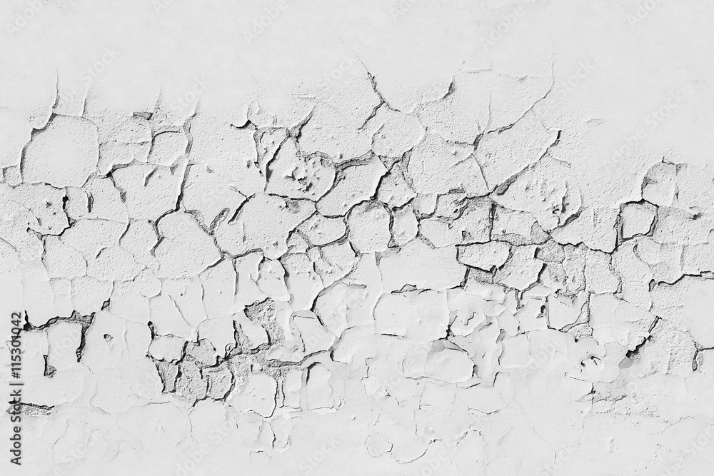Fototapeta premium White concrete wall with cracked flaking paint