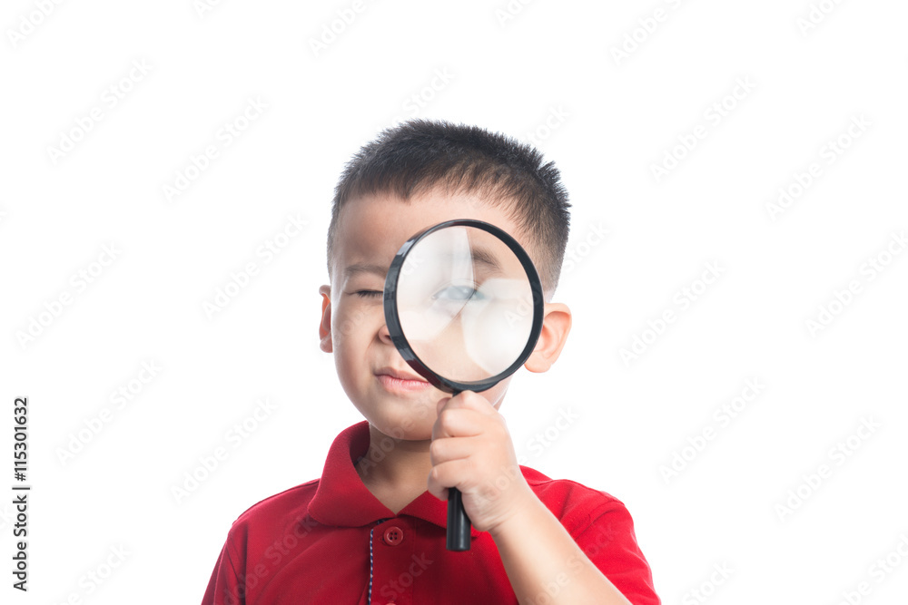 Portrait asian child looking through magnifying loupe Portrait asian child looking through magnifying loupe