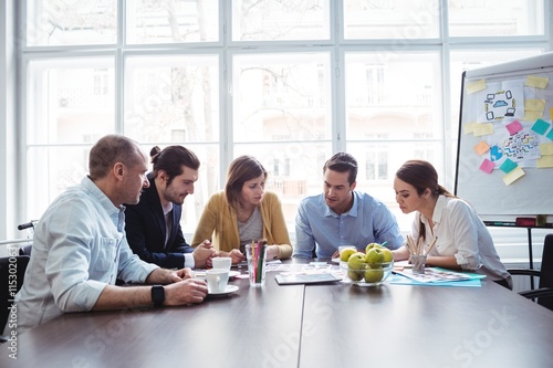 Photo editors in meeting room