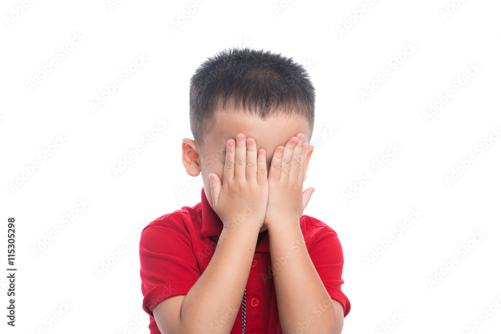 Portrait of cute smiling little boy closed eyes with his hand in studio Portrait of cute smiling little boy closed eyes with his hand in studio