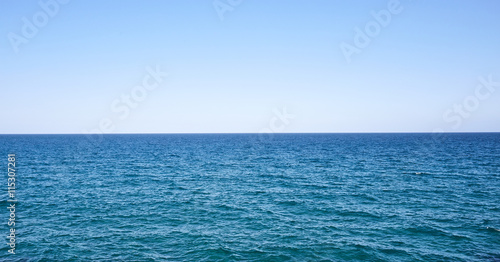 Perfect sky and water of ocean. Blue water of the sea. The horizon line on the water.