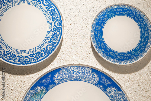 Porcelain chinaware on the white wall