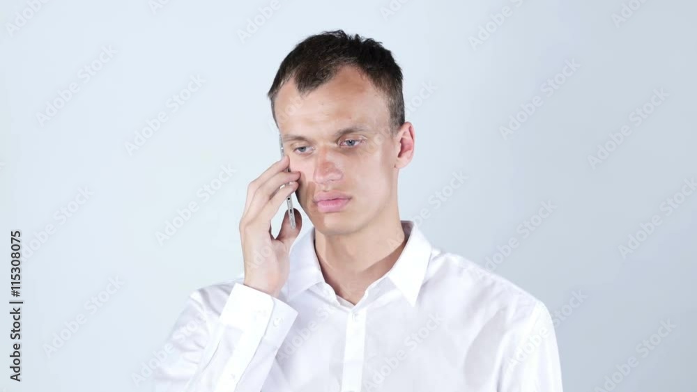 A handsome businessman calling by the phone A handsome businessman calling by the phone
