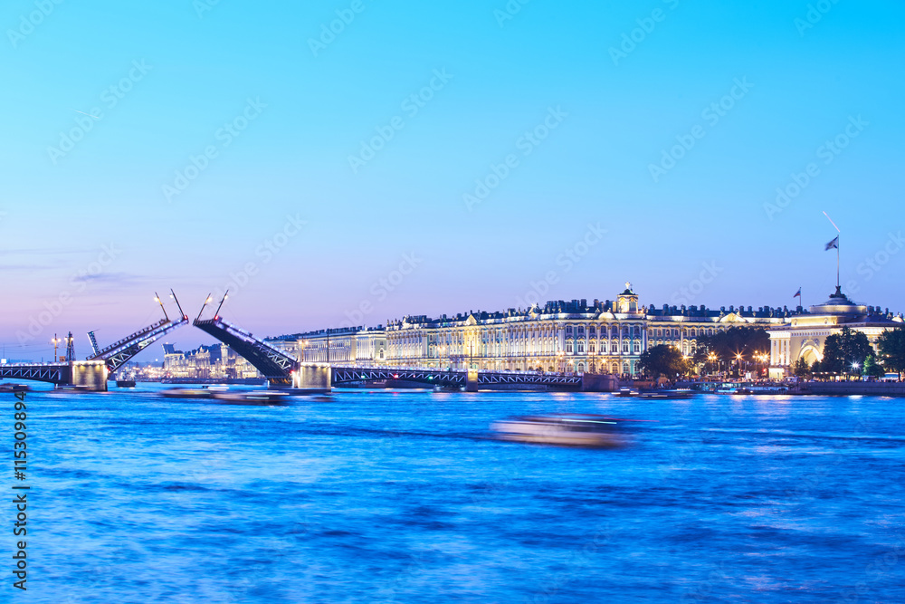 Russia, Saint-Petersburg, 02 July 2016: Opening Palace Bridge, a lot of Observing tourists, Neva River at sunrise, Winter Palace, the Hermitage, the Admiralty, a lot ships and boats, long exposure 