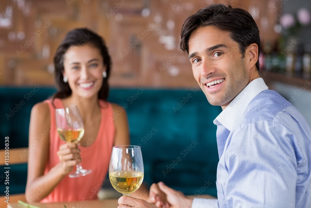 Young couple having champagne in restaurant Young couple having champagne in restaurant