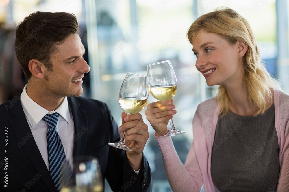 Smiling business colleagues toasting beer glass Smiling business colleagues toasting beer glass
