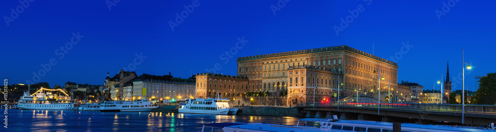 Royal palace in Stockholm illuminated at night - panoramic view